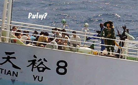 <em>Somali pirates holding crewmembers of the Chinese fishing vessel FV Tian Yu 8</em>