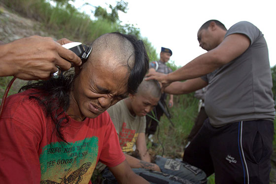 Punks in forced head shaving