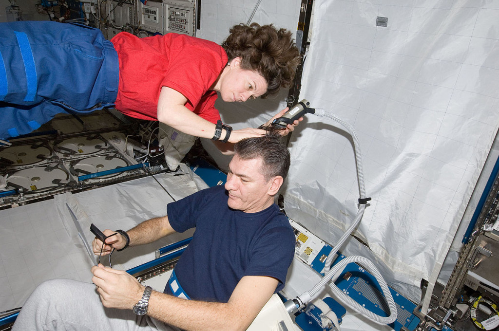 1200px-Haircut_in_ISS_ISS026-E-017736_(15_Jan._2011)